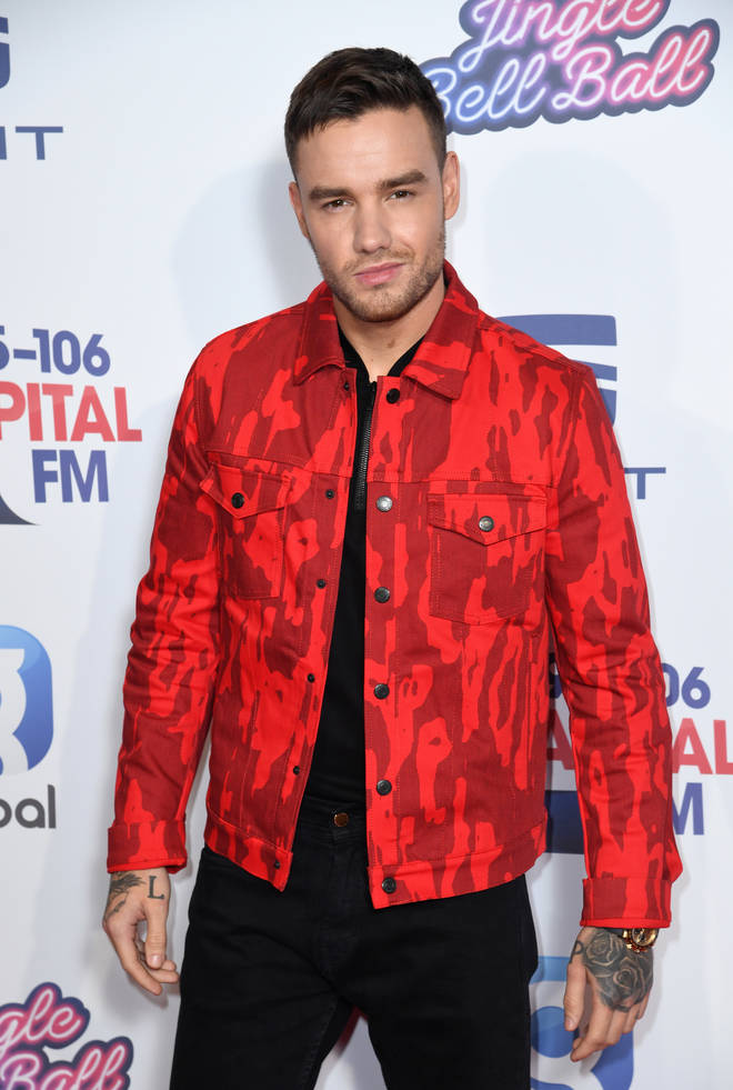Liam Payne wore all black with a red camouflage jacket