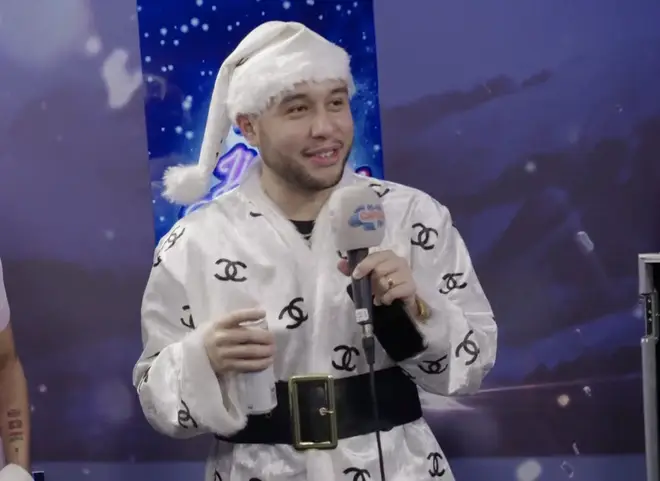 He wore a matching white Santa hat for his interview with Jimmy