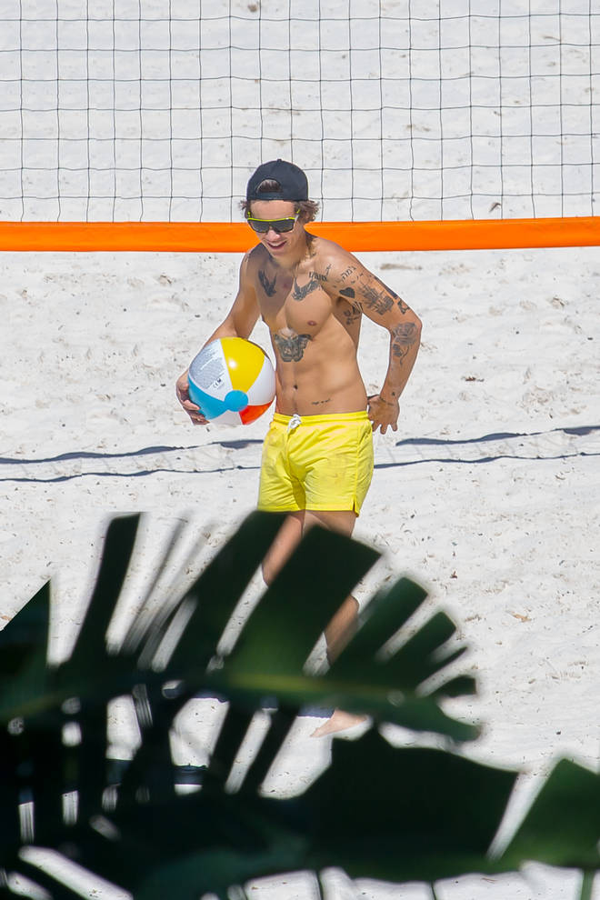 This isn't the first time Harry Styles's rocked yellow shorts on the beach