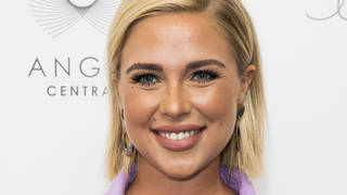 Love Island's Gabby Allen smiling at event