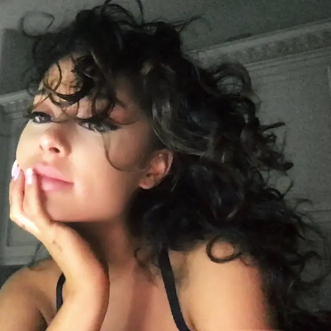 Ariana Grande posts rare shot of natural curly hair!