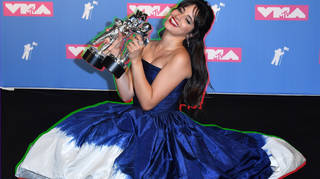 Camila Cabello holds her 2 awards for Video of the Year and Artist of the Year in the press room at the 2018 MTV Video Music Awards