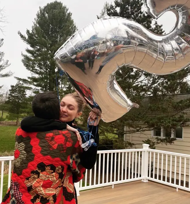 Gigi Hadid holding the balloon with blue strings convinced she's pregnant with a baby boy