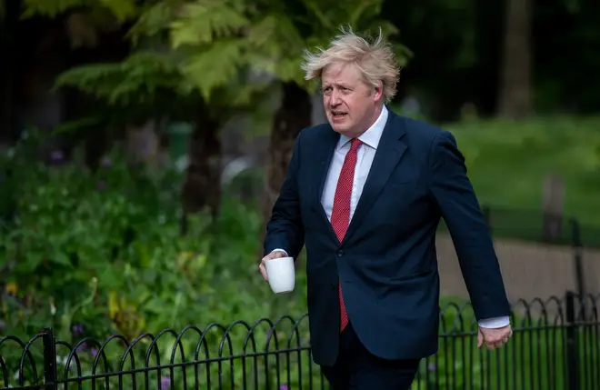 Boris Johnson demonstrating UK's eased lockdown rules