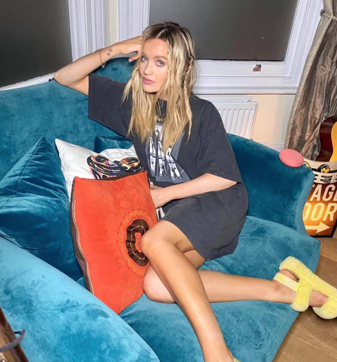 Laura Whitmore poses on their stylish armchair