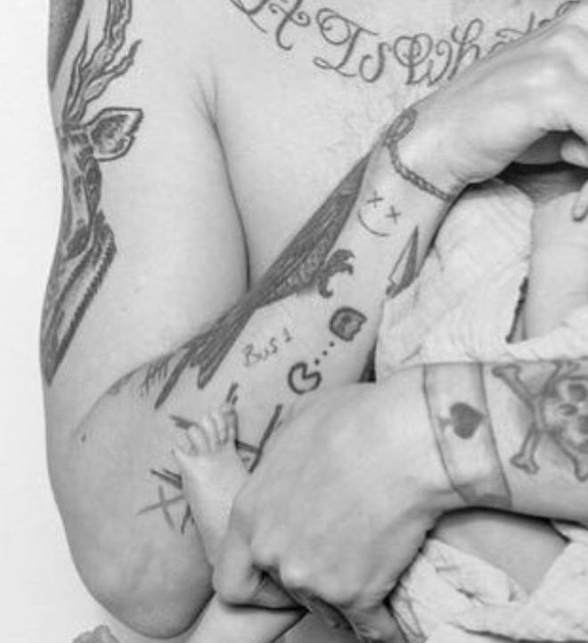 Louis Tomlinson's arm tattoos