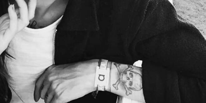 Louis Tomlinson's left wrist and arm tattoo.