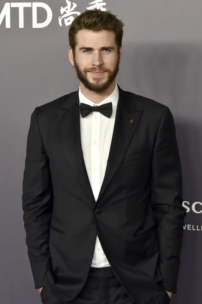 What is Liam Hemsworth's age and net worth?