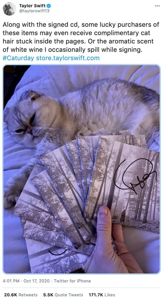 Taylor Swift posted a picture of herself signing copies of 'Folklore'