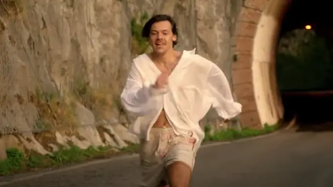 Harry Styles' running in a white shirt makes it feel like summer