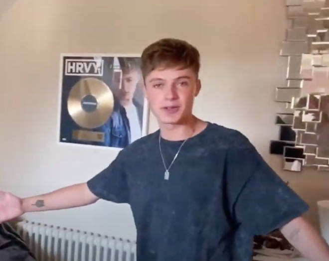 HRVY shows off his musical plaques at home