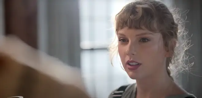 Taylor Swift opened a wardrobe filled with cardigans in the advert