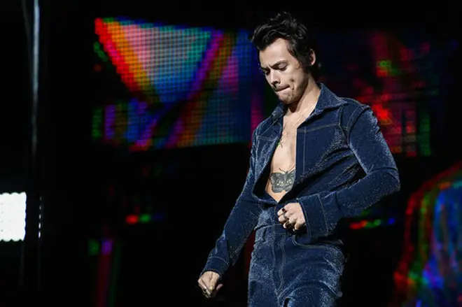 Harry Styles wore the glittery shirt unbuttoned to the waist because he's Harry Styles