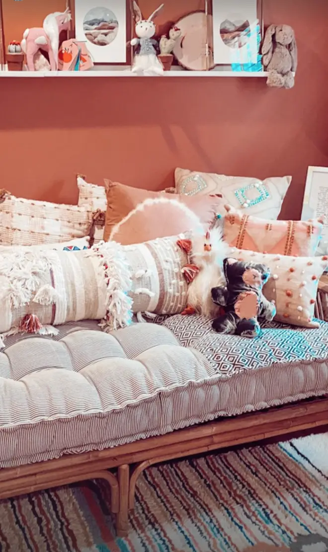 Baby Zigi has a room filled with cuddly toys and books