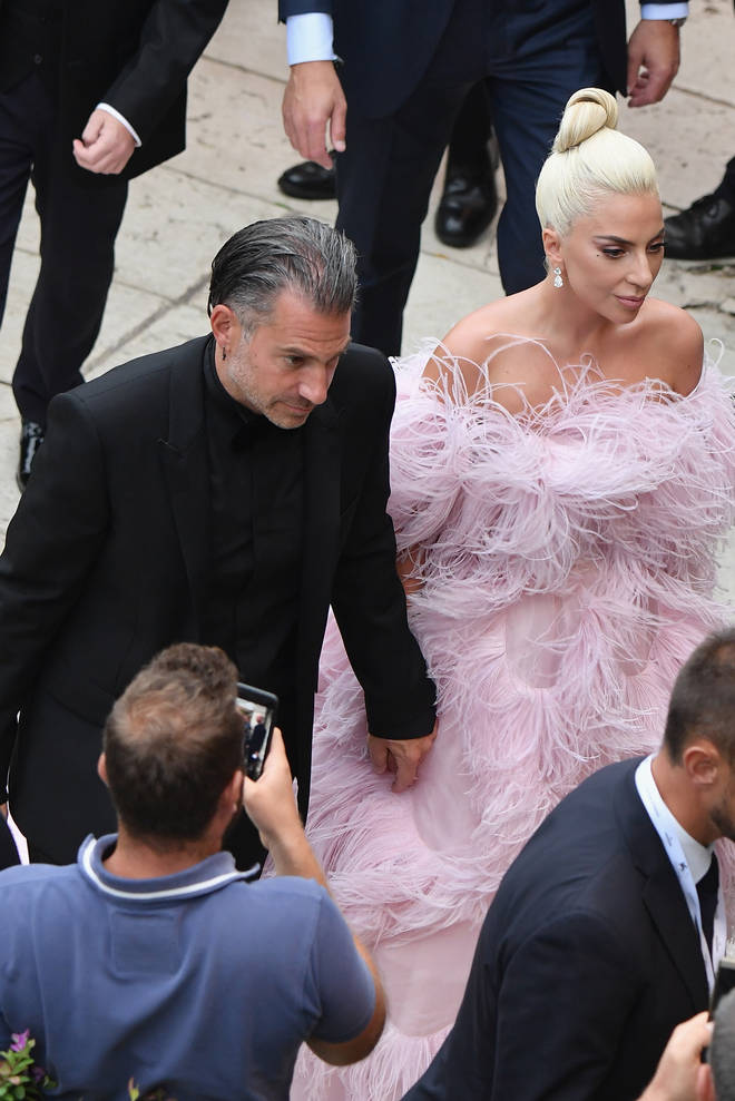 Lady Gaga holding hands with Christian Carino at Venice Film Festival