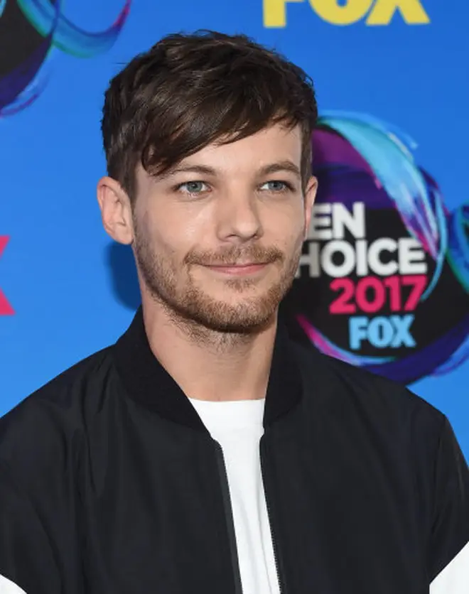 Louis Tomlinson's fans are looking back at his group photos