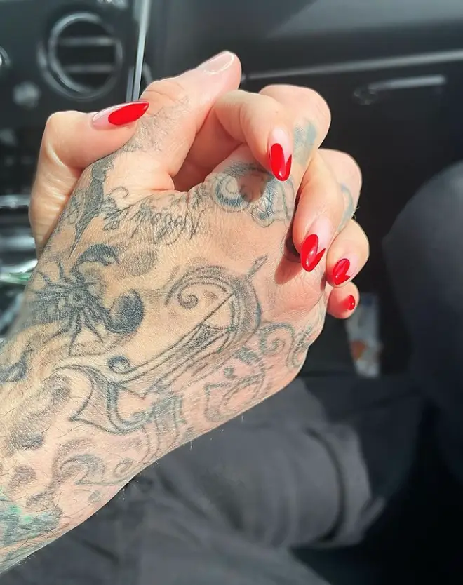 Kourtney Kardashian shared this cute photo of her holding hands with Travis Barker