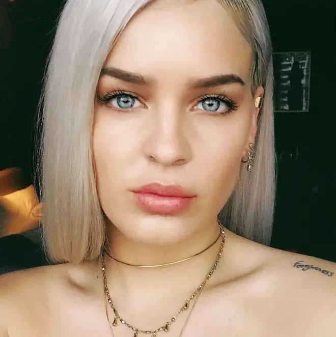 Anne-Marie has a "forgiveness" tattoo on her shoulder.