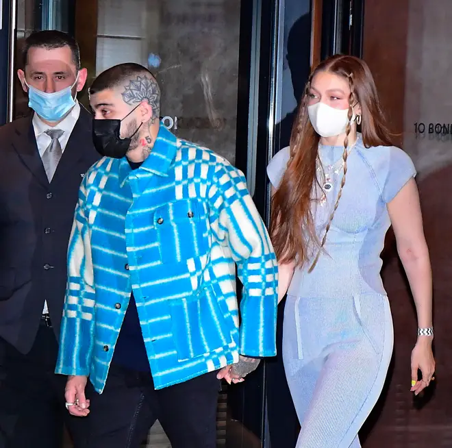 Gigi Hadid and Zayn Malik held hands as they left their home.