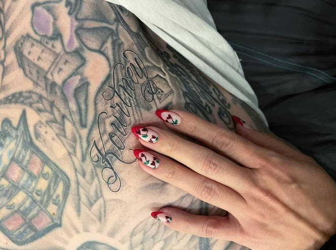 Travis Barker got Kourtney Kardashian's name tattooed on his chest.