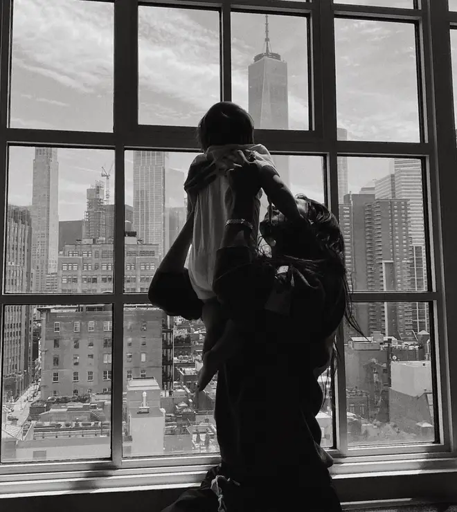 Bella Hadid holding up her niece Khai