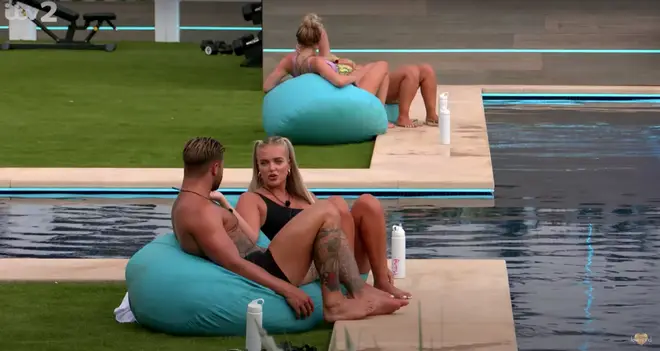 Jake Cornish and Mary Bedford have a chat by the pool