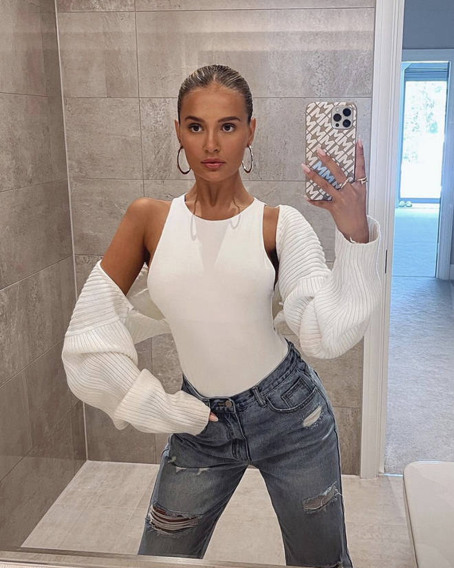 Molly-Mae Hague taking mirror selfies in white top and jeans