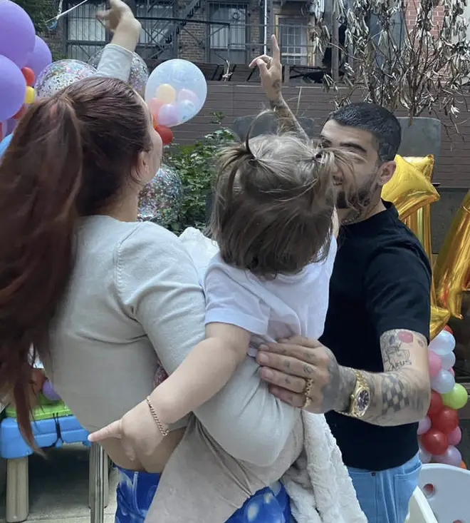 Gigi and Zayn with baby Khai as she turned one