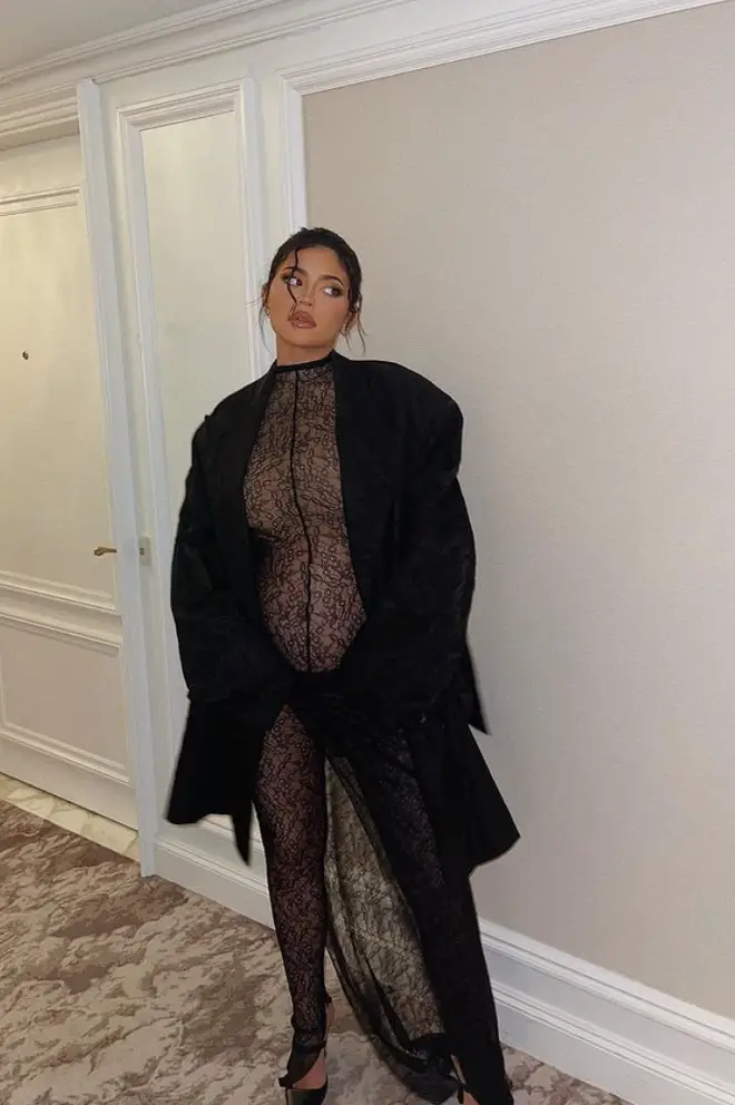 Kylie Jenner flaunts her bump in a sultry lace number
