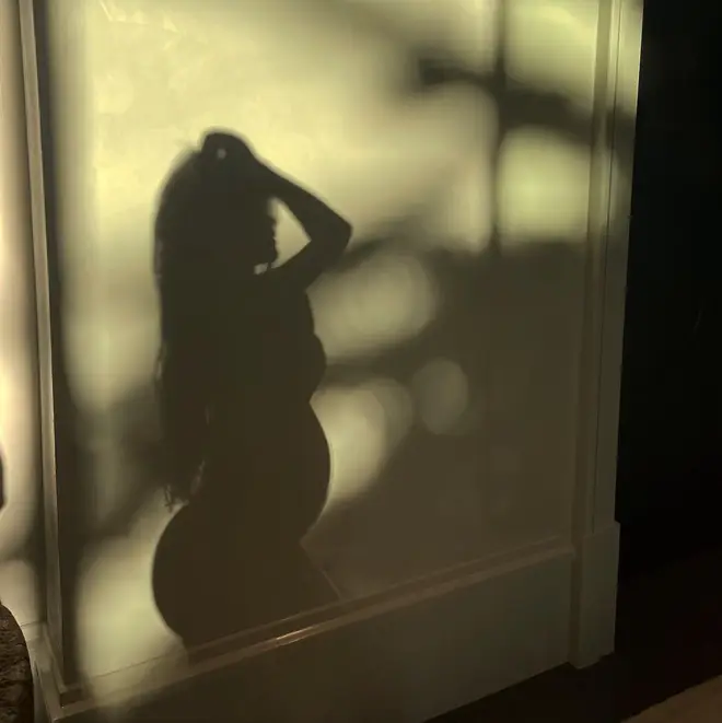 Kylie Jenner shows of the silhouette of her bump