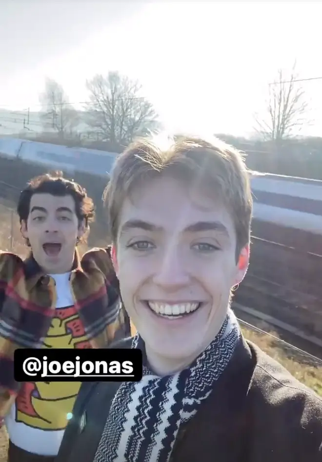 Joe Jonas looked as excited as Francis to be train spotting