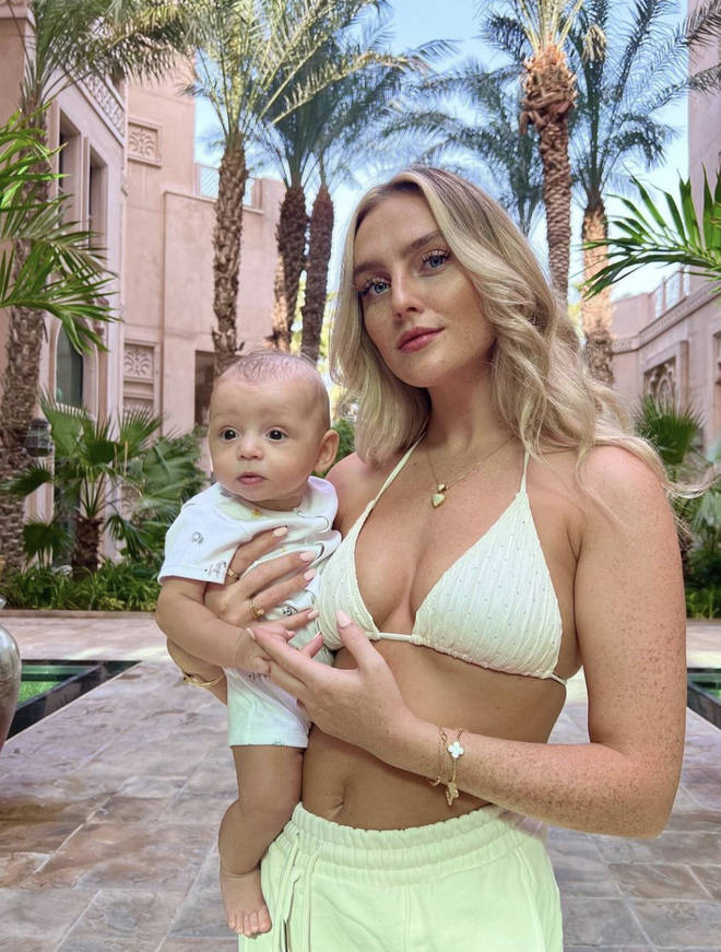 Perrie looks stunning while holding baby Axel