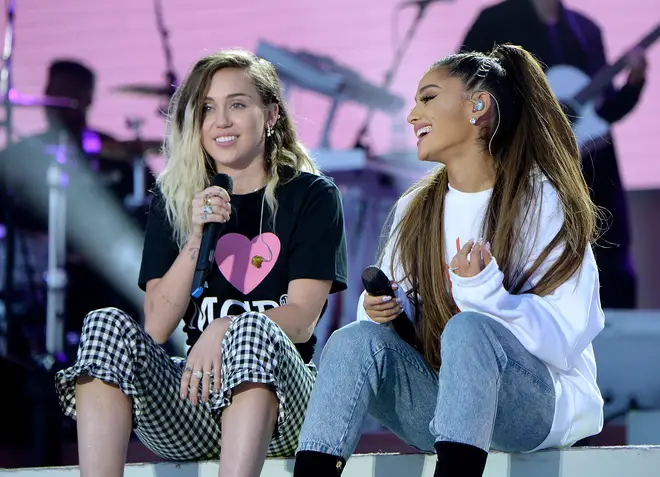 Ariana Grande and Miley Cyrus singing at the One Love Manchester concert