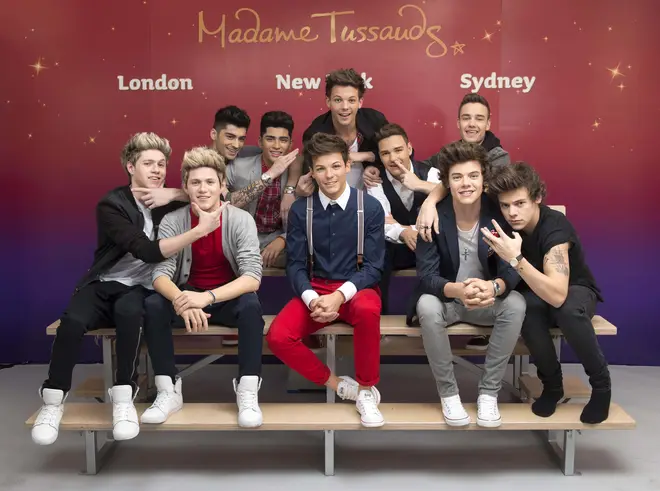 The One Direction boys with their wax figures