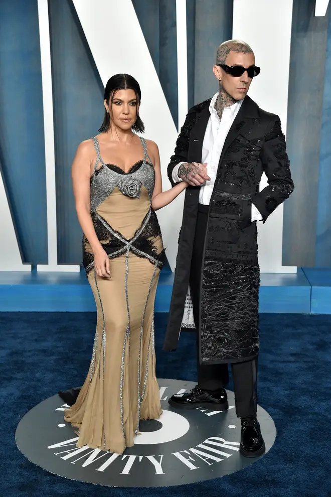 Kourtney Kardashian and fiancé Travis Barker walked the red carpet at the 2022 Vanity Fair Oscar Party