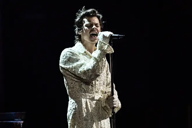 Harry rocks a jumpsuit like a rockstar