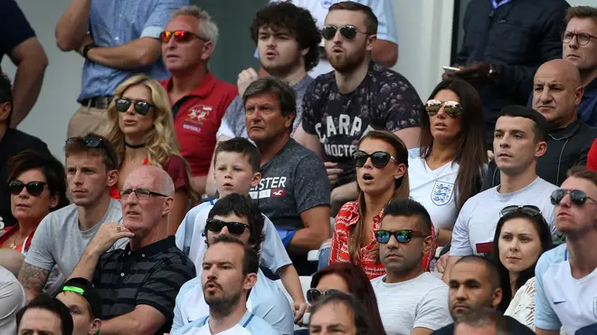 Coleen Rooney and Rebekah Vardy supporting their husbands during a 2016 England match