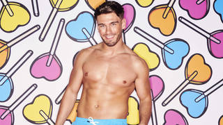Love Island contestant Jacques O’Neill with heart background