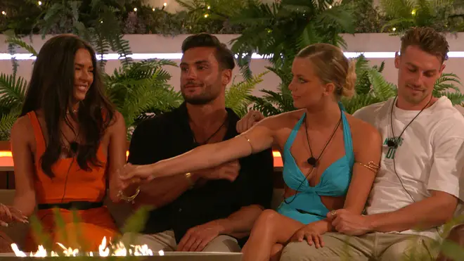 Love Island couples around the fire pit in the villa