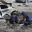 Emergency workers in Kharkiv, Ukraine, following a rocket attack