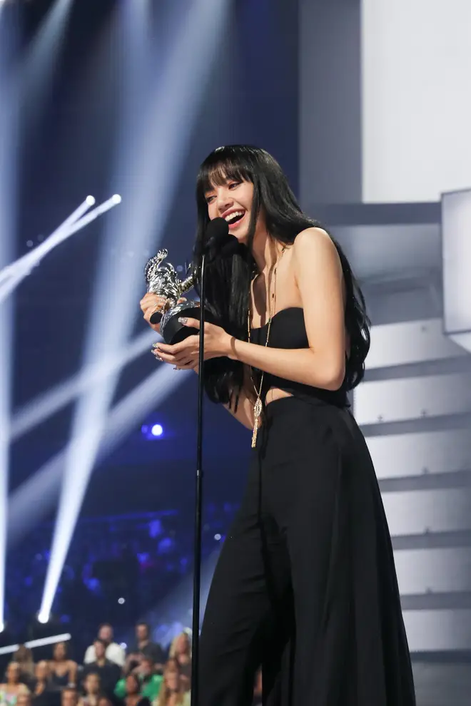 Lisa accepts the award for Best K-Pop onstage