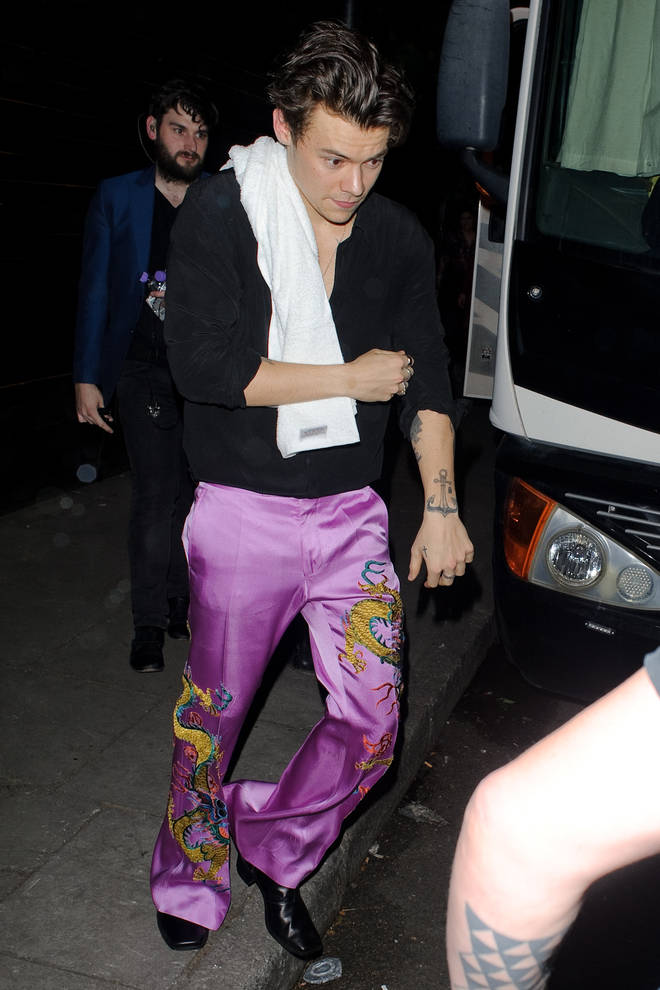 Harry Styles was spotted leaving a secret gig in London wearing these amazing silk trousers