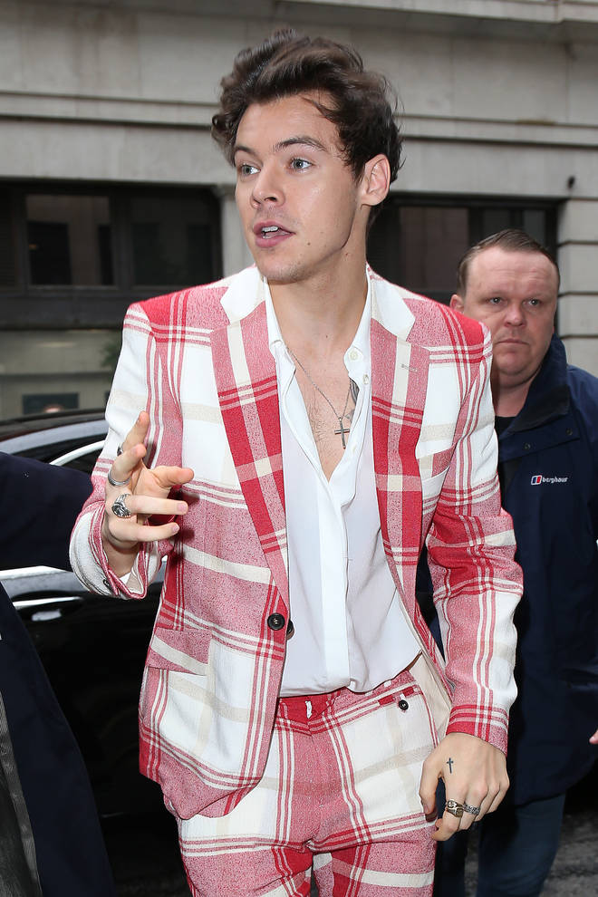 Harry Styles wearing a chequered suit in London
