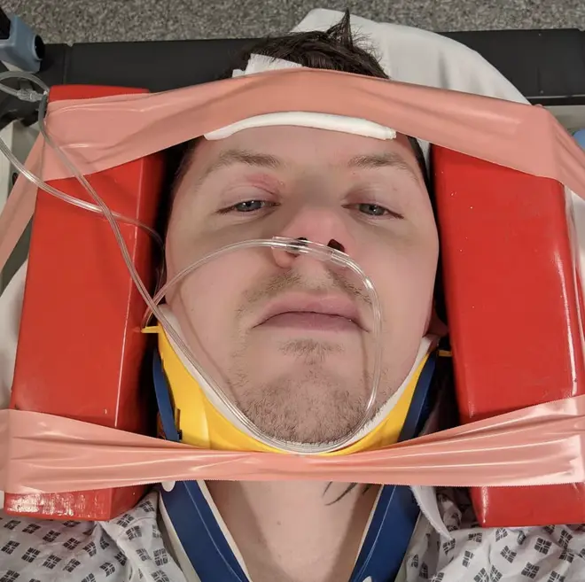 Professor Green posts a photo from the stretcher after injuring his neck after a seizure