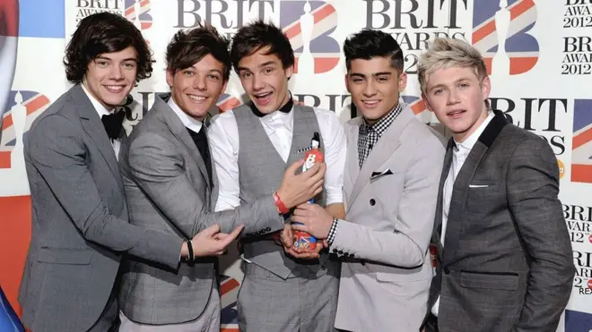 One Direction holding their BRIT award for 'British Single Of The Year