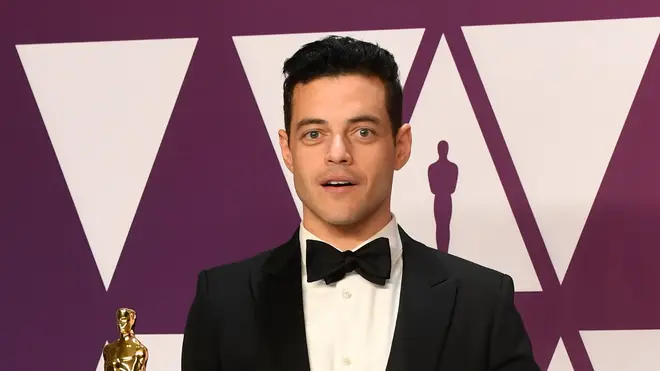 Rami Malek shows off his Oscar for Best Actor