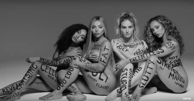 Little Mix's music video for 'Strip' saw them write insults on themselves in protest