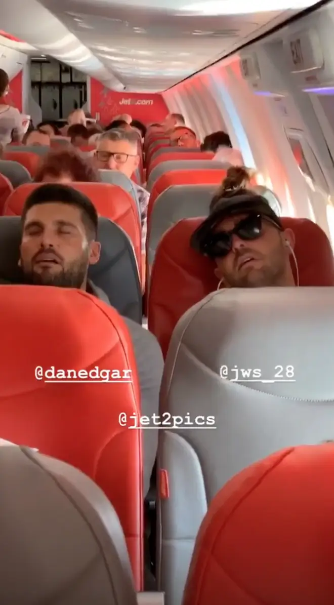 Chloe Sims took this picture of Dan Edgar asleep on the plane