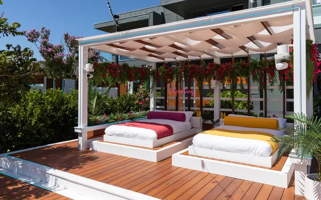 Love Island's poolside area has comfy daybeds
