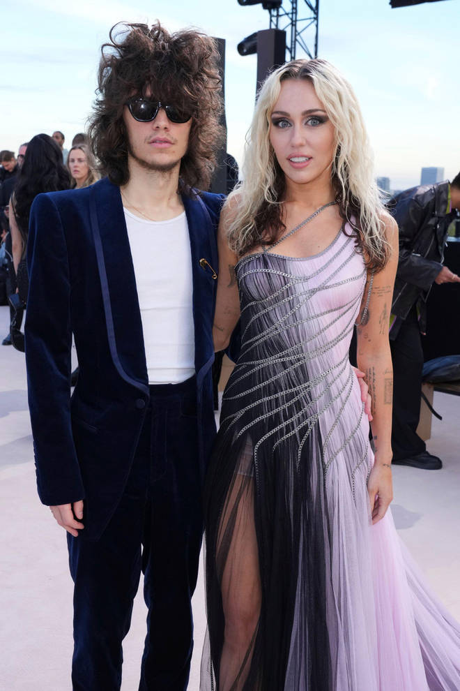 Miley Cyrus and Maxx Morando attend the Versace Fall/Winter collection presentation